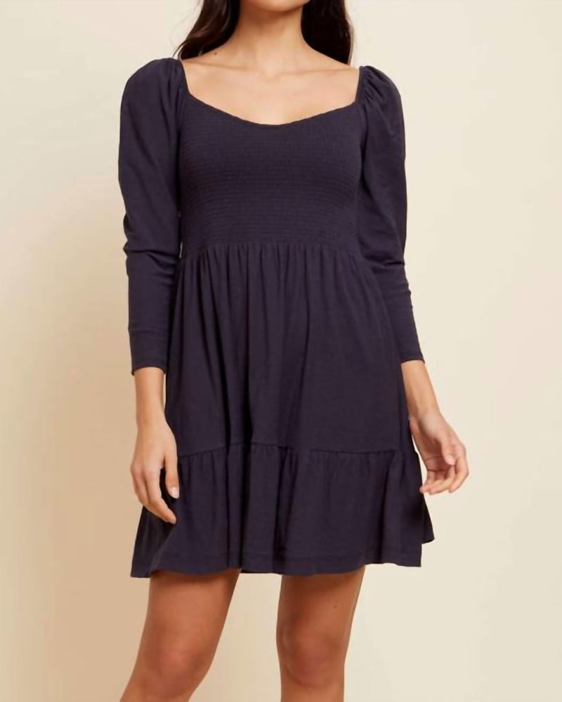 Front of a model wearing a size Large Noel Babydoll Dress in Navy in Navy by Nation LTD. | dia_product_style_image_id:342691